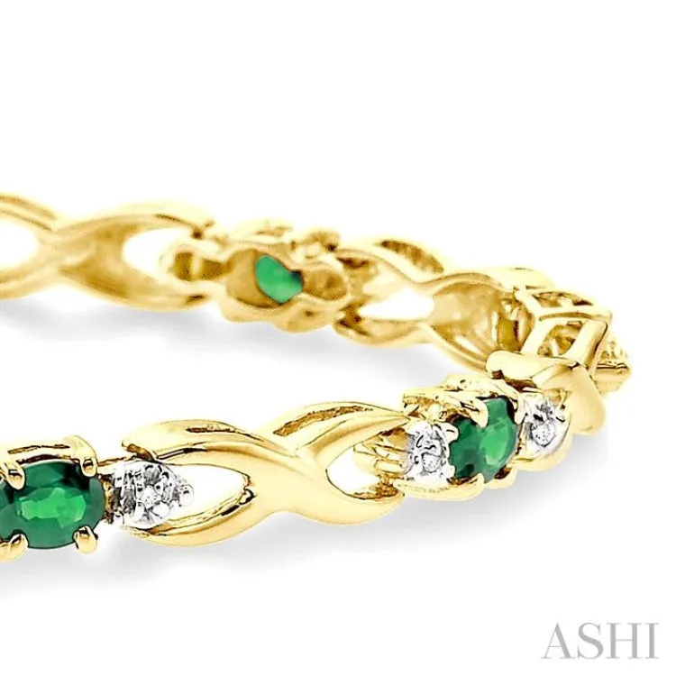 4x3mm Oval Cut Emerald and 1/10 Ctw Single Cut Diamond Bracelet in 10K Yellow Gold